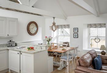 Gather around the large dining table to enjoy a family meal or board game.