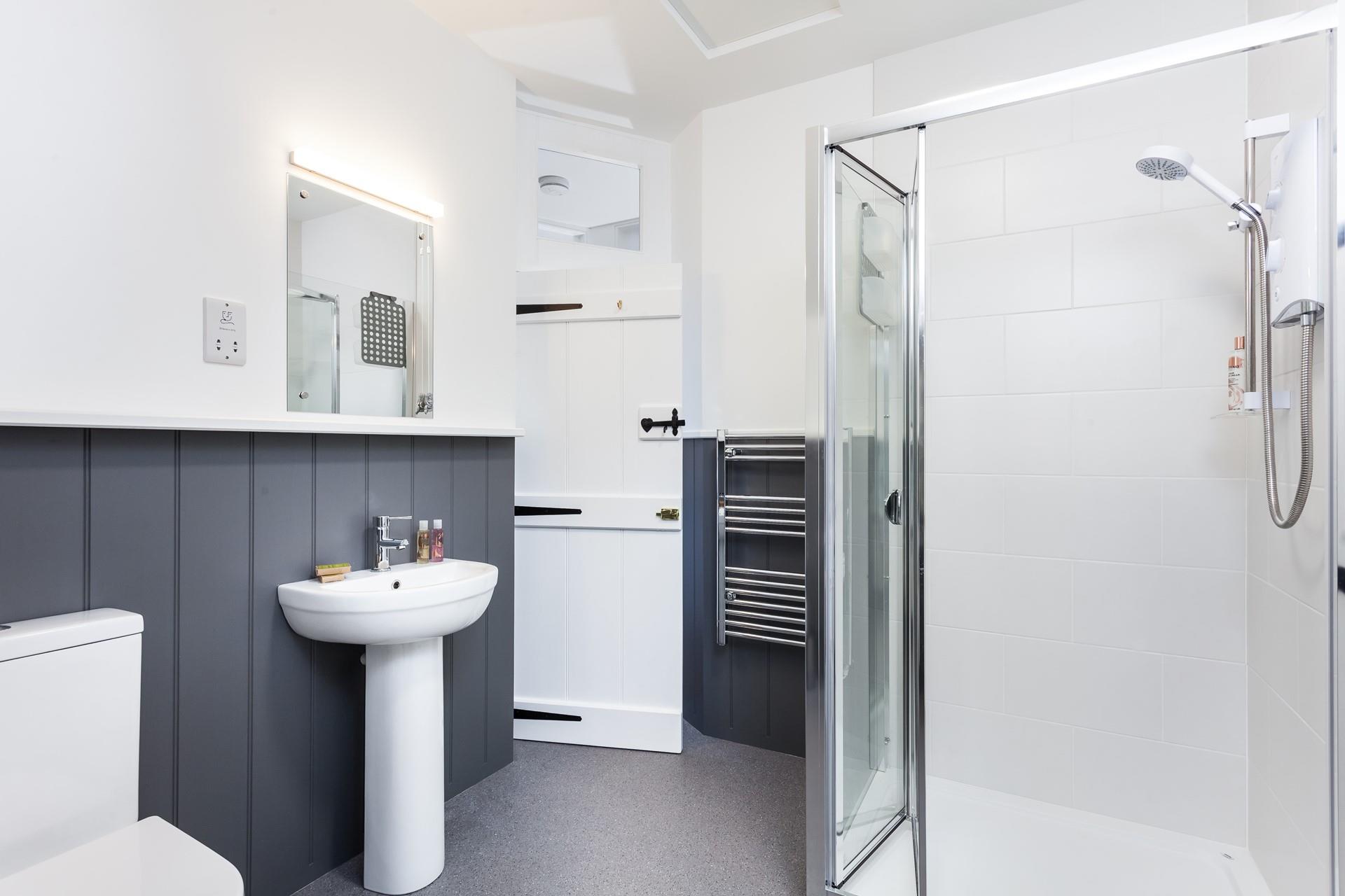 Wash off sandy toes in the shower after a day on the beach.