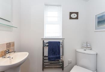 The handy downstairs cloakroom has a WC and basin.