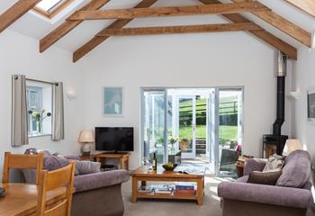 The bright and airy open plan living space is the perfect place to relax with idyllic rural views outside. 