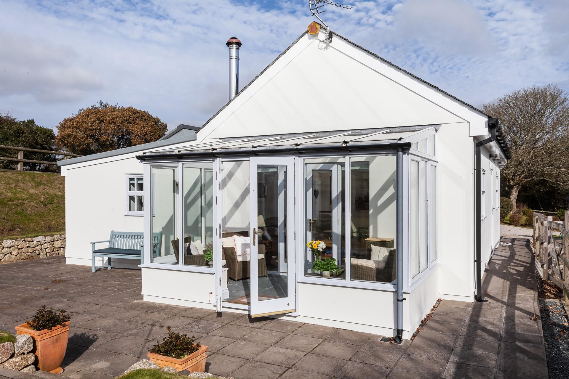 The Cowshed is surrounded by pasture land, flowers and pretty countryside. 