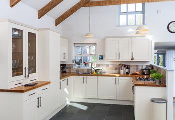 The kitchen blends country chic with modern appliances making it an absolute dream to cook in.