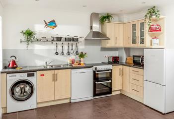 The kitchen is fully equipped to prepare tasty meals.