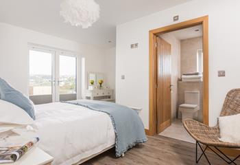 Wake up to the gentle roll of the waves in bedroom 1, with stunning sea views.