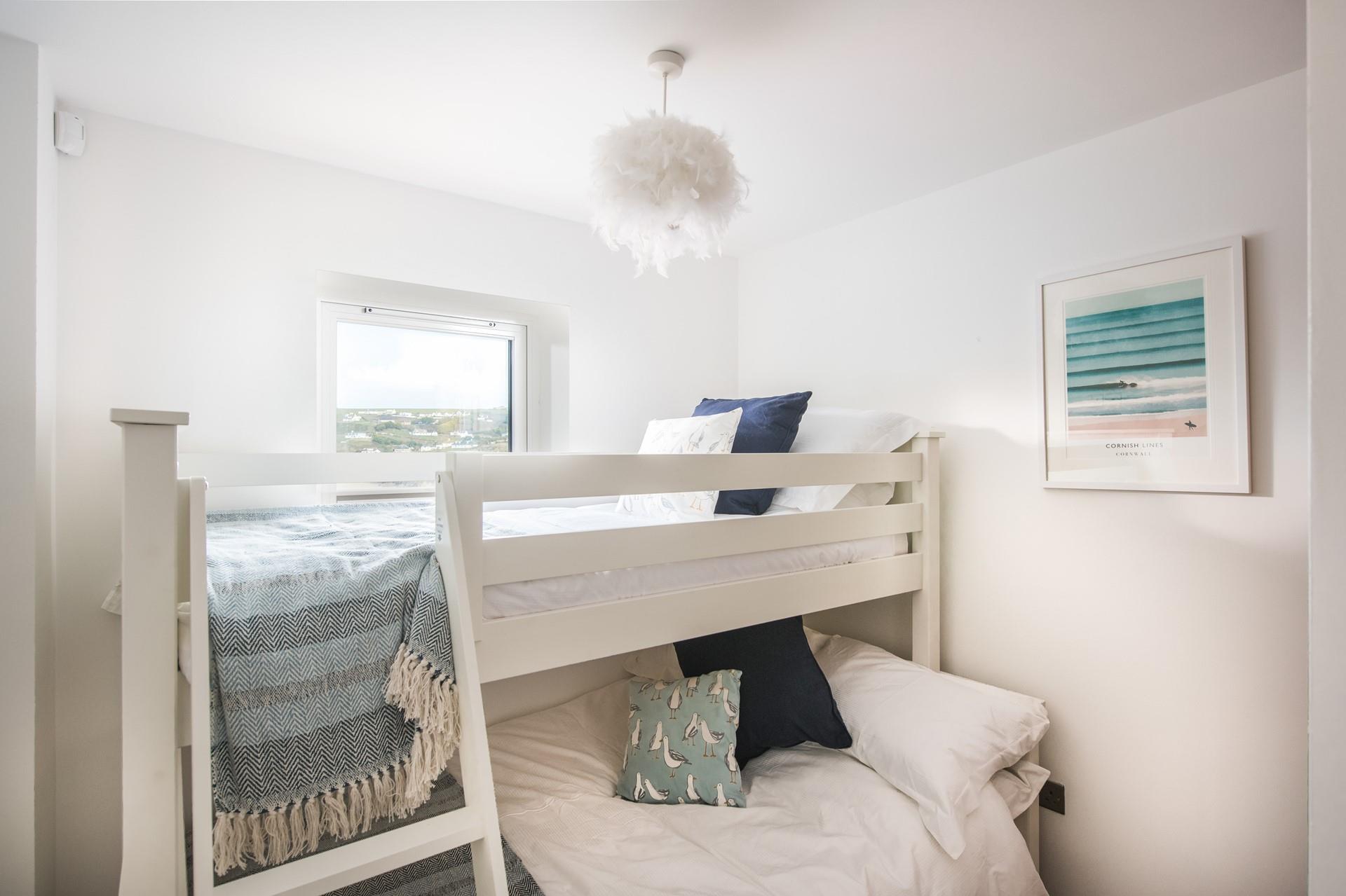 Wake up to sea views from the triple sleeper bunk beds.
