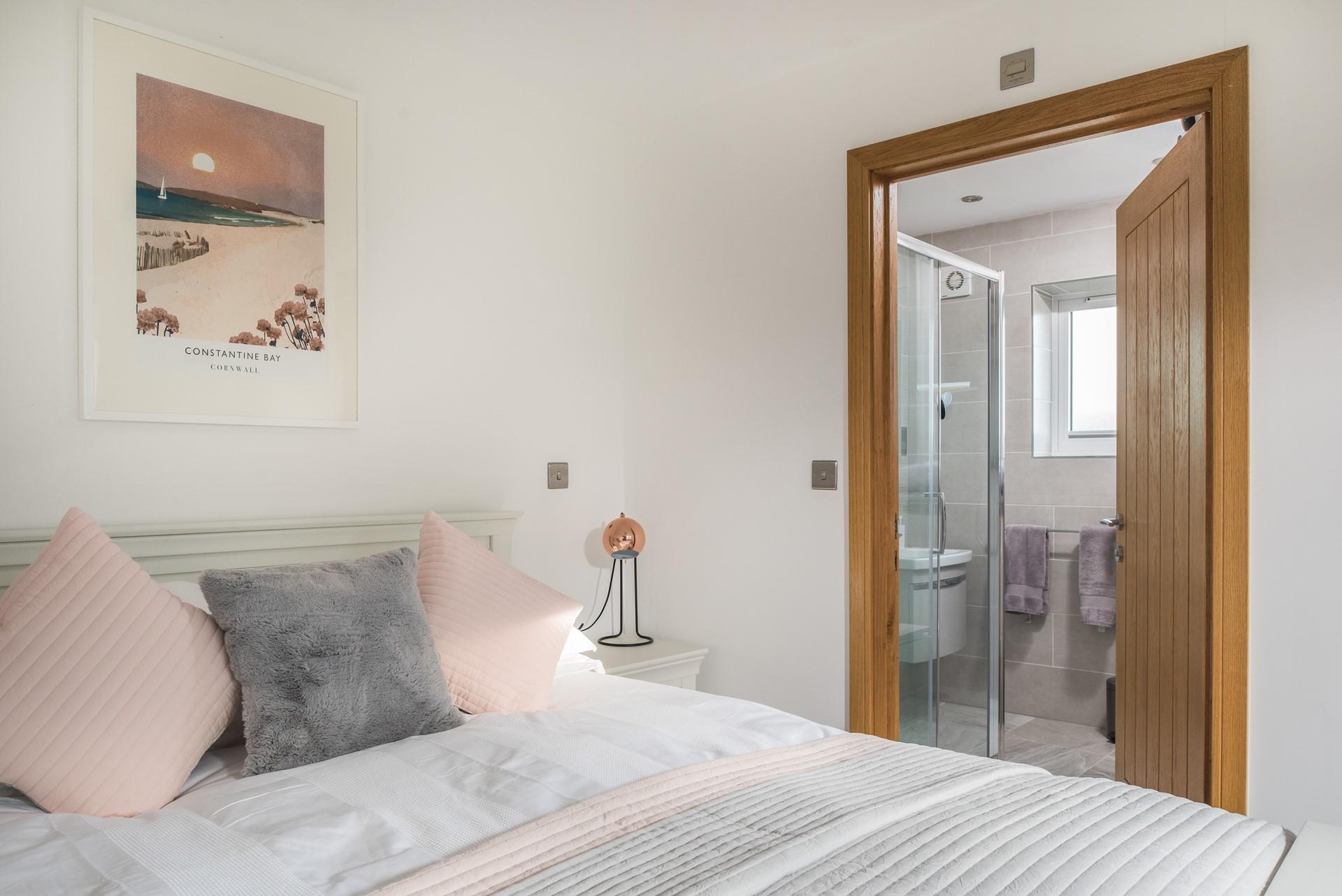 Wake up and step into the en suite for a refreshing shower. 