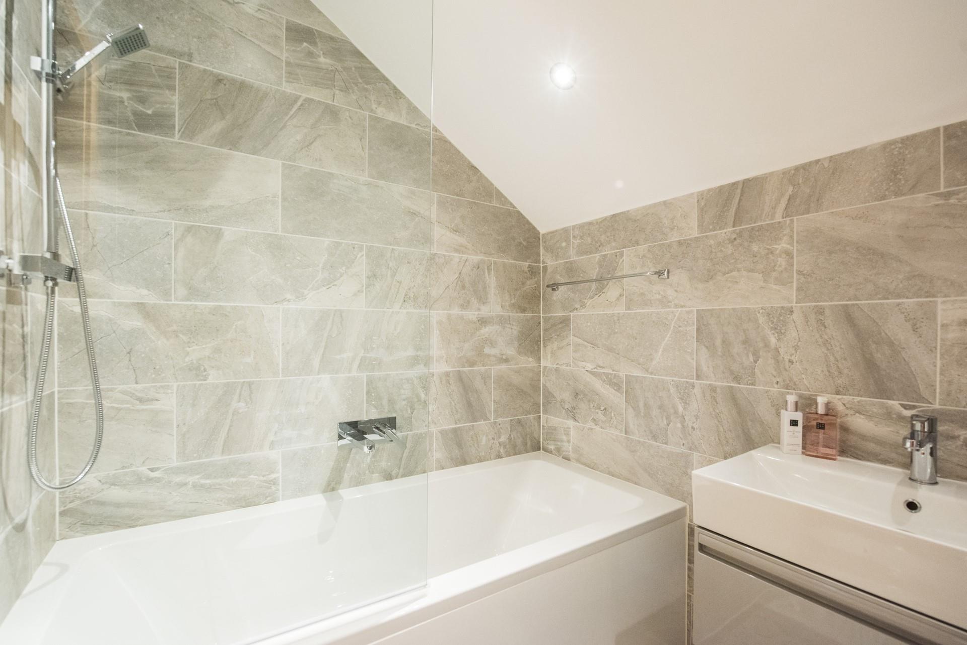 Pamper yourself in the spacious family bathroom with a bath and shower. 