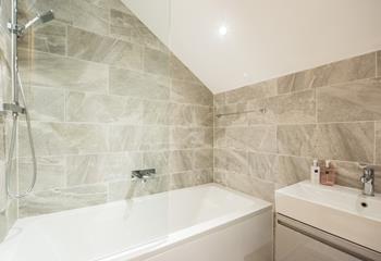 Pamper yourself in the spacious family bathroom with a bath and shower. 