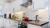 The kitchen is fully equipped for cooking tasty meals and preparing picnics for days out.
