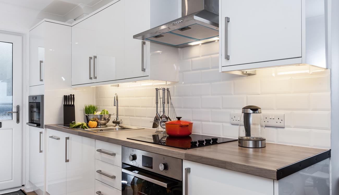 The kitchen is fully equipped for cooking tasty meals and preparing picnics for days out.