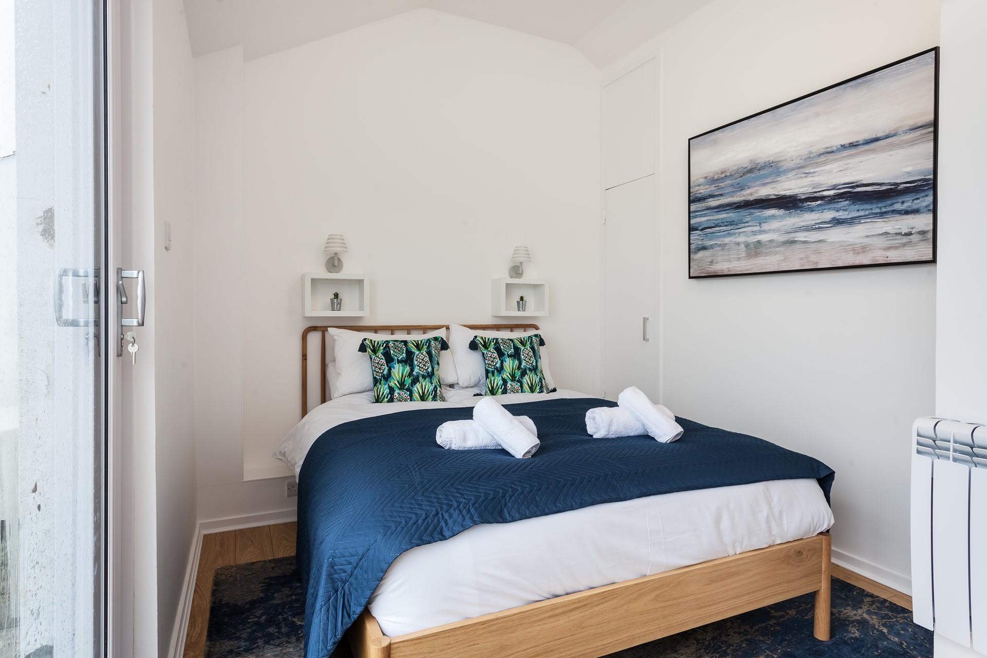 Bedroom 2 has a spacious double bed for resting each night.