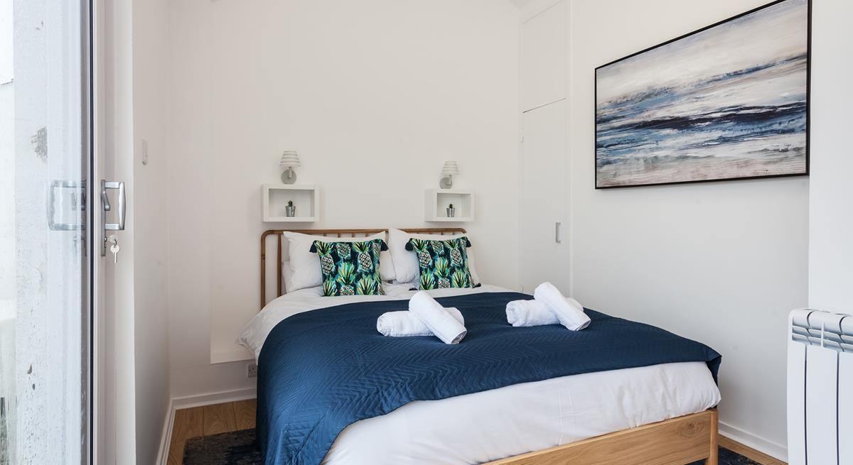 Bedroom 2 has a spacious double bed for resting each night.