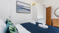 Fluffy towels and soft sheets await in bedroom 2.