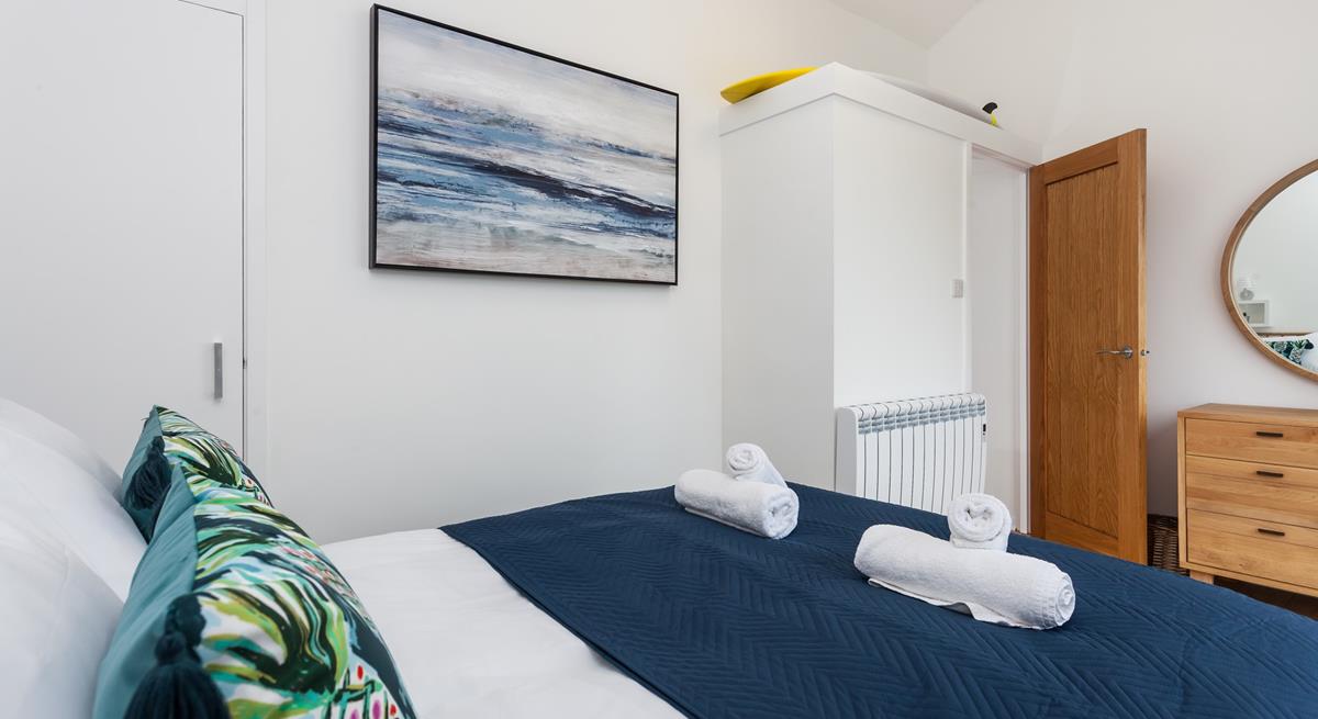 Fluffy towels and soft sheets await in bedroom 2.