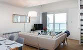 Sink into the corner sofa and enjoy the views over Porthmeor. - Thumbnail Image