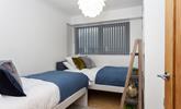 The twin bedroom is perfect for young adults or children to tuck into. - Thumbnail Image