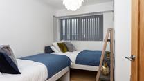 The twin bedroom is perfect for young adults or children to tuck into.