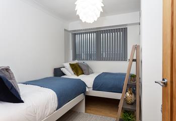 The twin bedroom is perfect for young adults or children to tuck into.