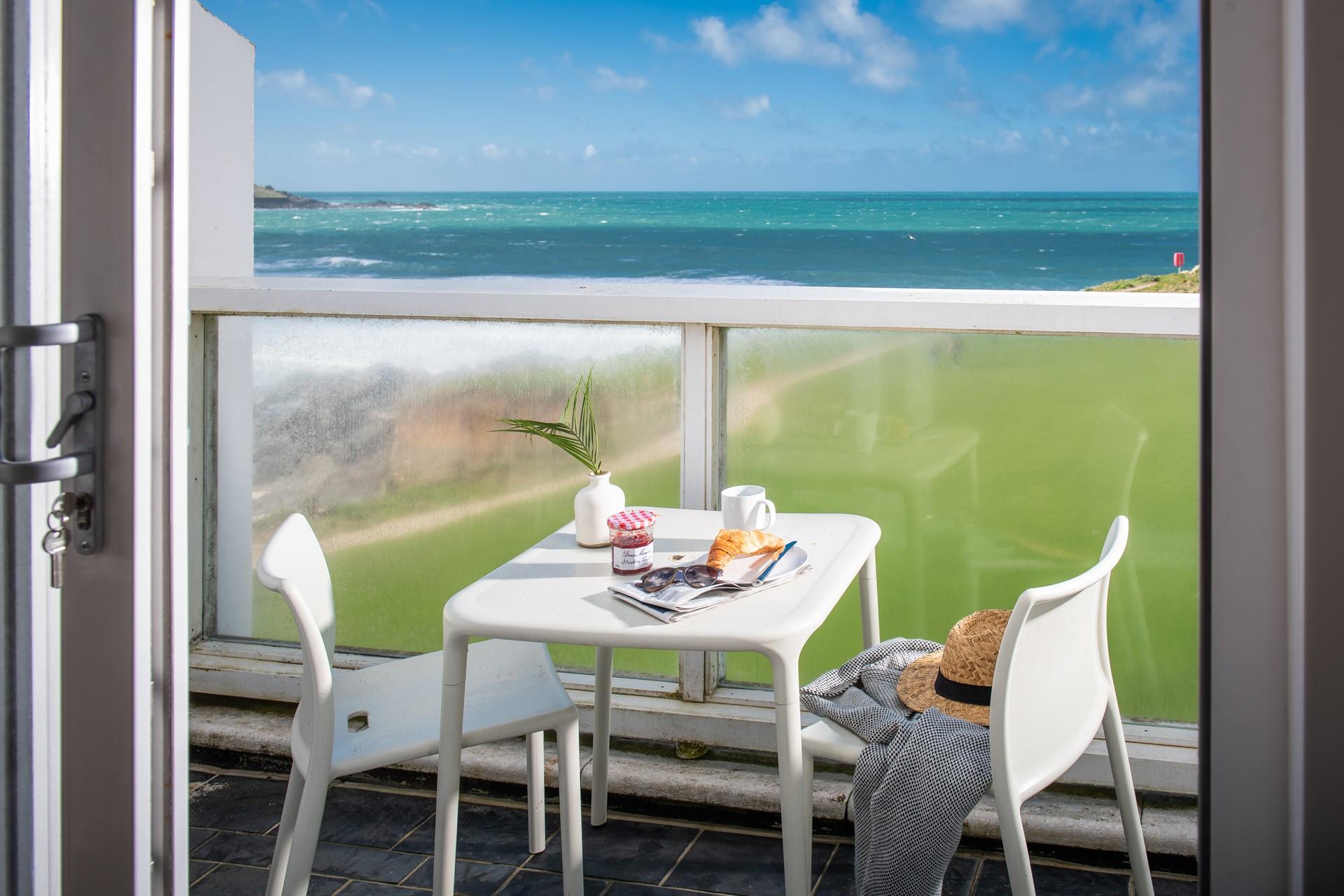 Start the day with pastries on the balcony with a sea view.