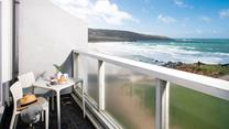 Watch the waves roll in and out on a gorgeous summer's day.