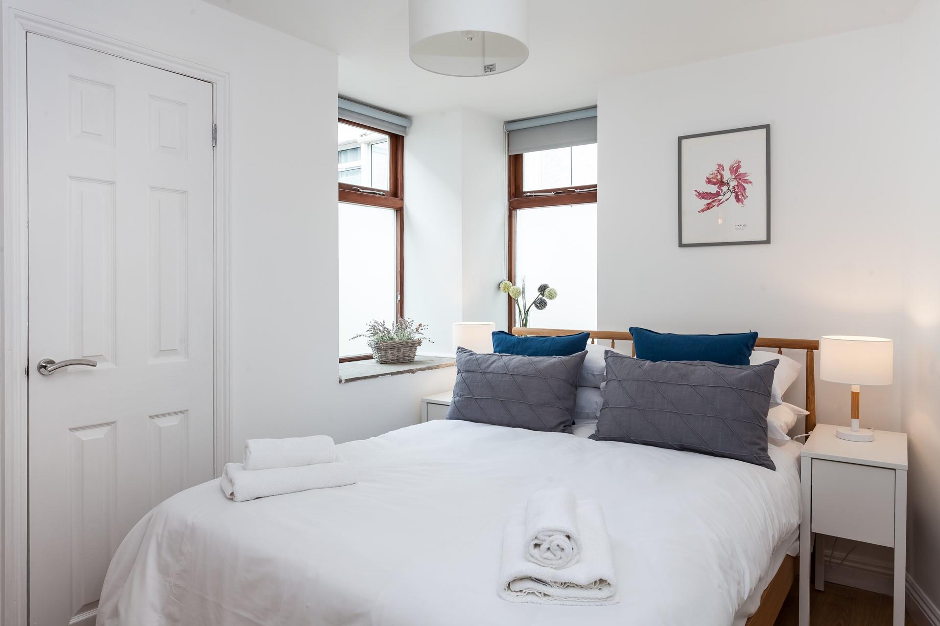 The cosy double bedroom also has an en suite shower room. 