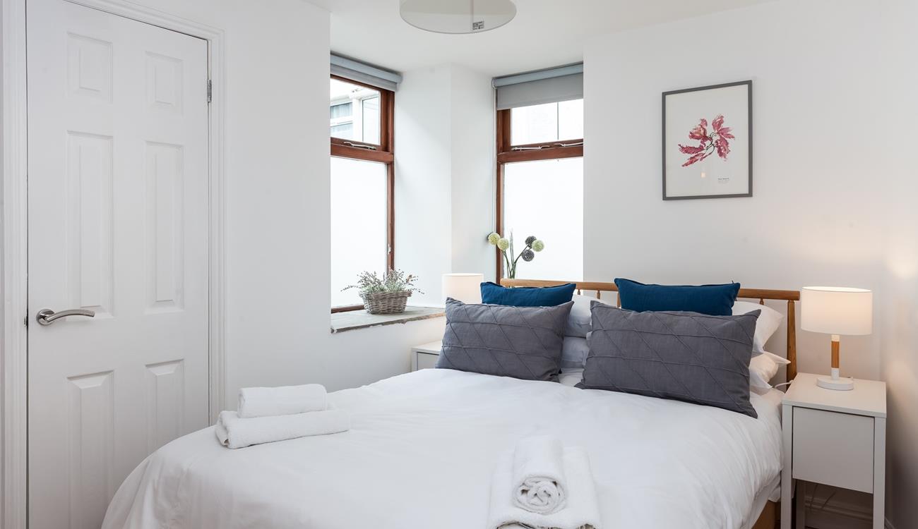 The cosy double bedroom also has an en suite shower room. 