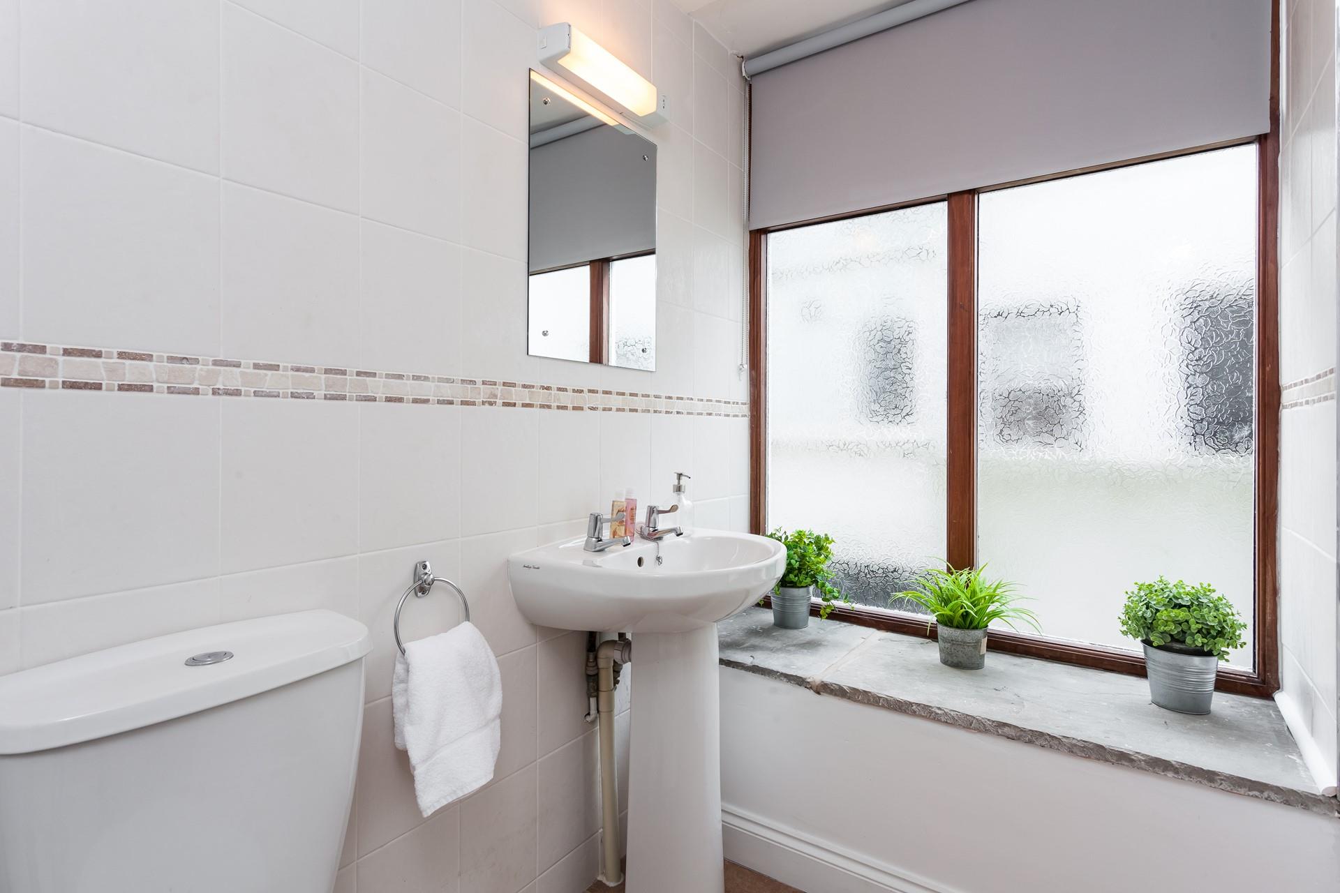 Freshen up in the en suite shower room which is big enough for two. 