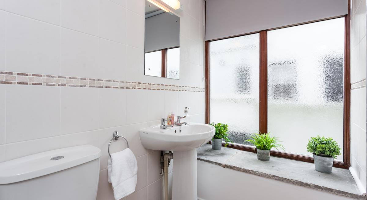 Freshen up in the en suite shower room which is big enough for two. 