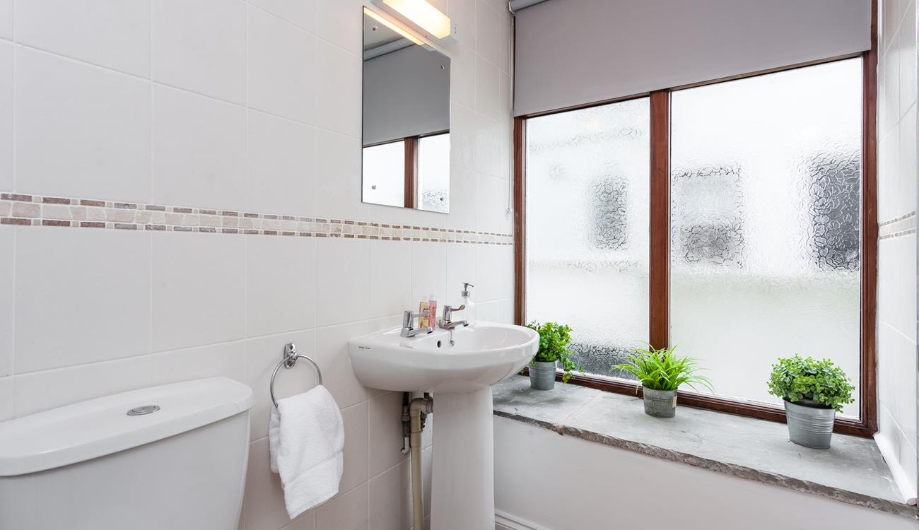 Freshen up in the en suite shower room which is big enough for two. 