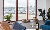 Enjoy unrivalled views across St Ives harbour during your romantic getaway, from the comfy sofa and chairs in the living room.  - Thumbnail Image