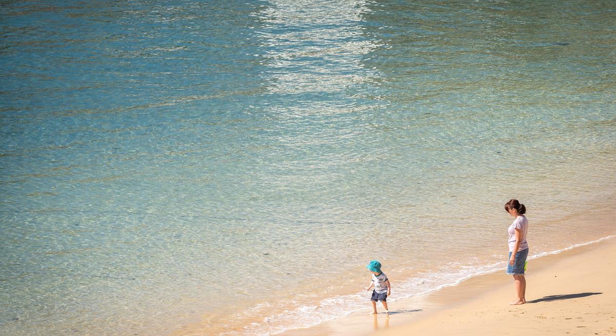 Treat yourself to an early morning stroll along the golden beach.