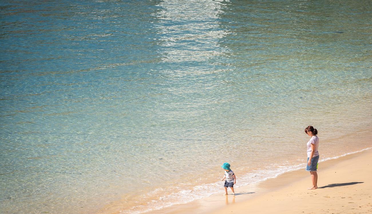 Treat yourself to an early morning stroll along the golden beach.