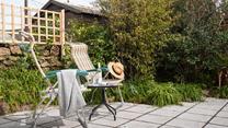 Pour yourself a drink, grab a book and take a moment to relax on the patio in the garden.