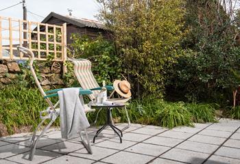Pour yourself a drink, grab a book and take a moment to relax on the patio in the garden.