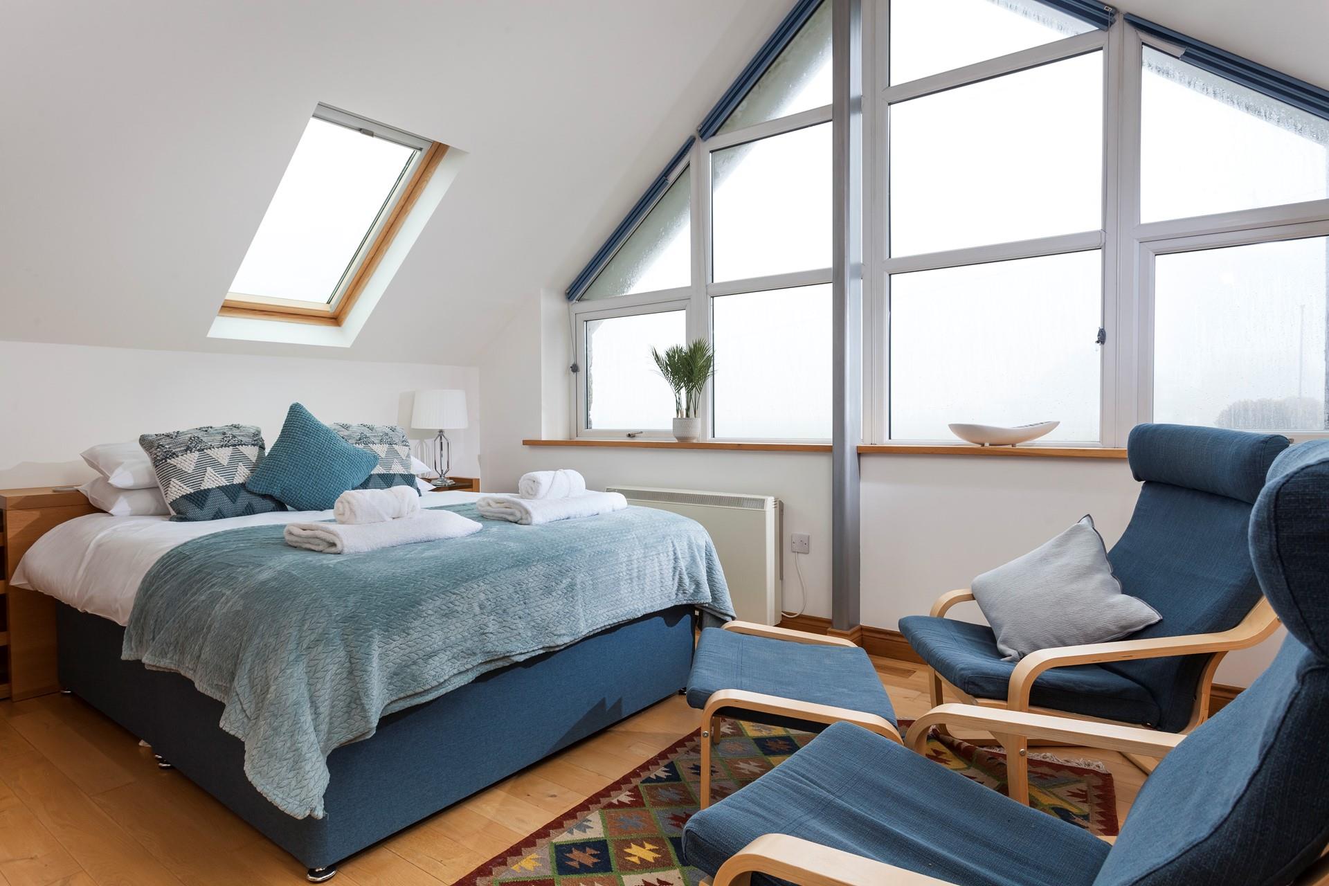 The stylish A-frame window fills the room with natural light. 