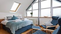 The stylish A-frame window fills the room with natural light. 