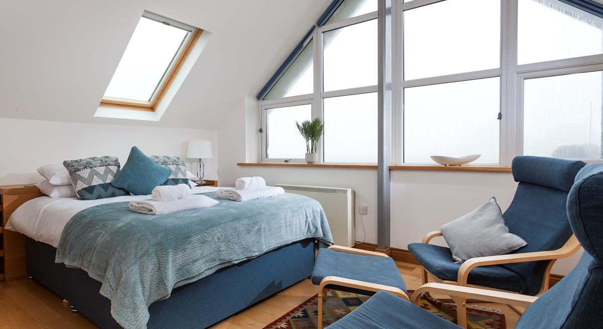 The stylish A-frame window fills the room with natural light. 