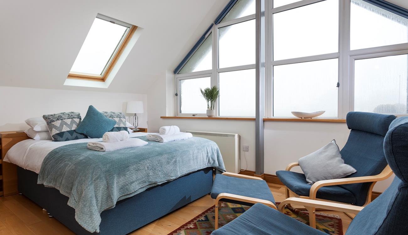 The stylish A-frame window fills the room with natural light. 