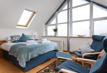 The stylish A-frame window fills the room with natural light. 