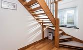 We love how the open staircase allows the light to stream through. - Thumbnail Image