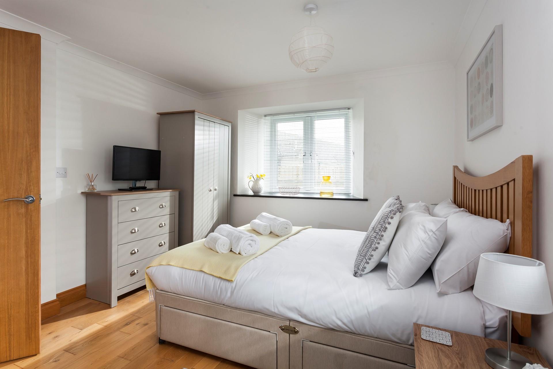 Light and spacious, bedroom 1 has plenty of room to unpack and make yourself at home. 