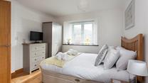 Light and spacious, bedroom 1 has plenty of room to unpack and make yourself at home. 