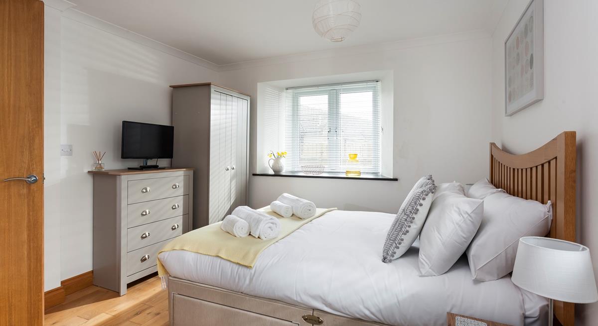 Light and spacious, bedroom 1 has plenty of room to unpack and make yourself at home. 