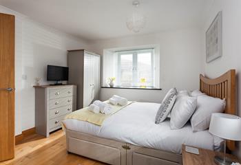 Light and spacious, bedroom 1 has plenty of room to unpack and make yourself at home. 