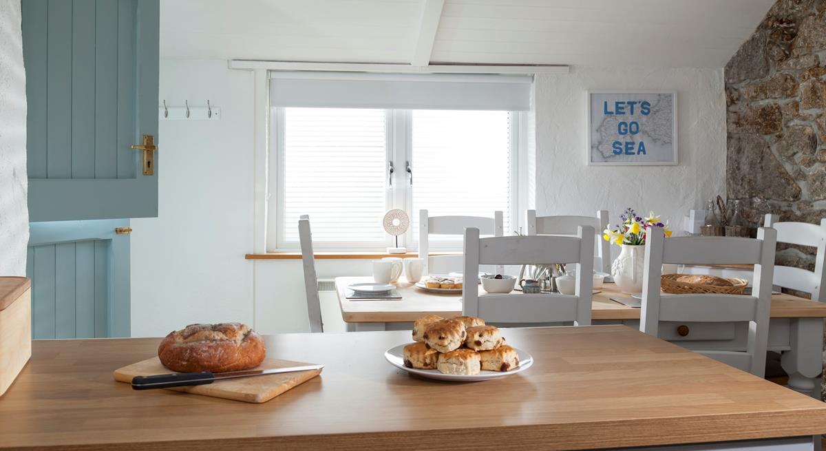 With its stable door, exposed granite wall, farmhouse-style table and slanted roof, the dining room exudes character and charm.