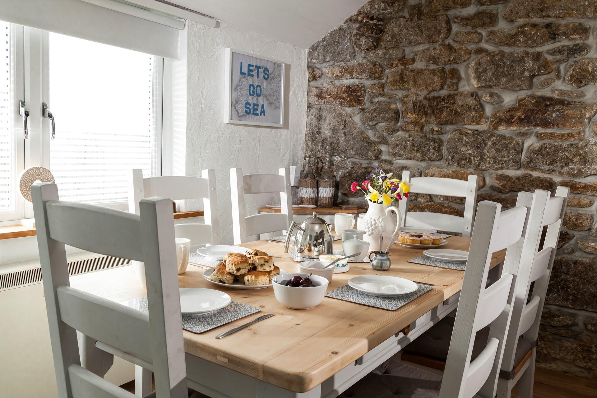 Gather together for a Cornish cream tea in the light and airy dining area. 