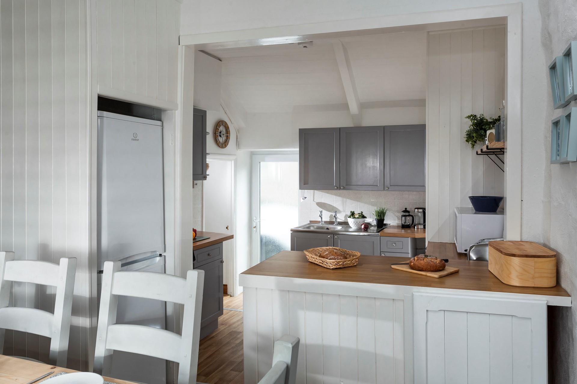 The open plan kitchen diner is well-designed for cooking whilst socialising. 