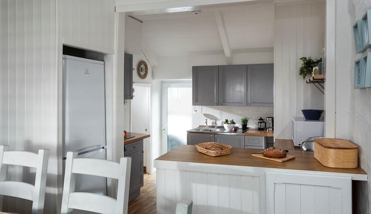 The open plan kitchen diner is well-designed for cooking whilst socialising. 