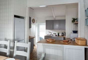 The open plan kitchen diner is well-designed for cooking whilst socialising. 