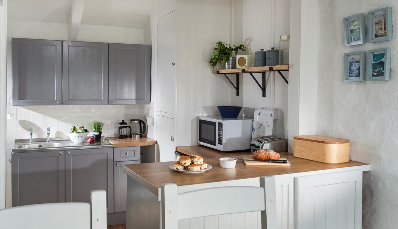 Quaint and welcoming, the kitchen is well-equipped with everything you need. 